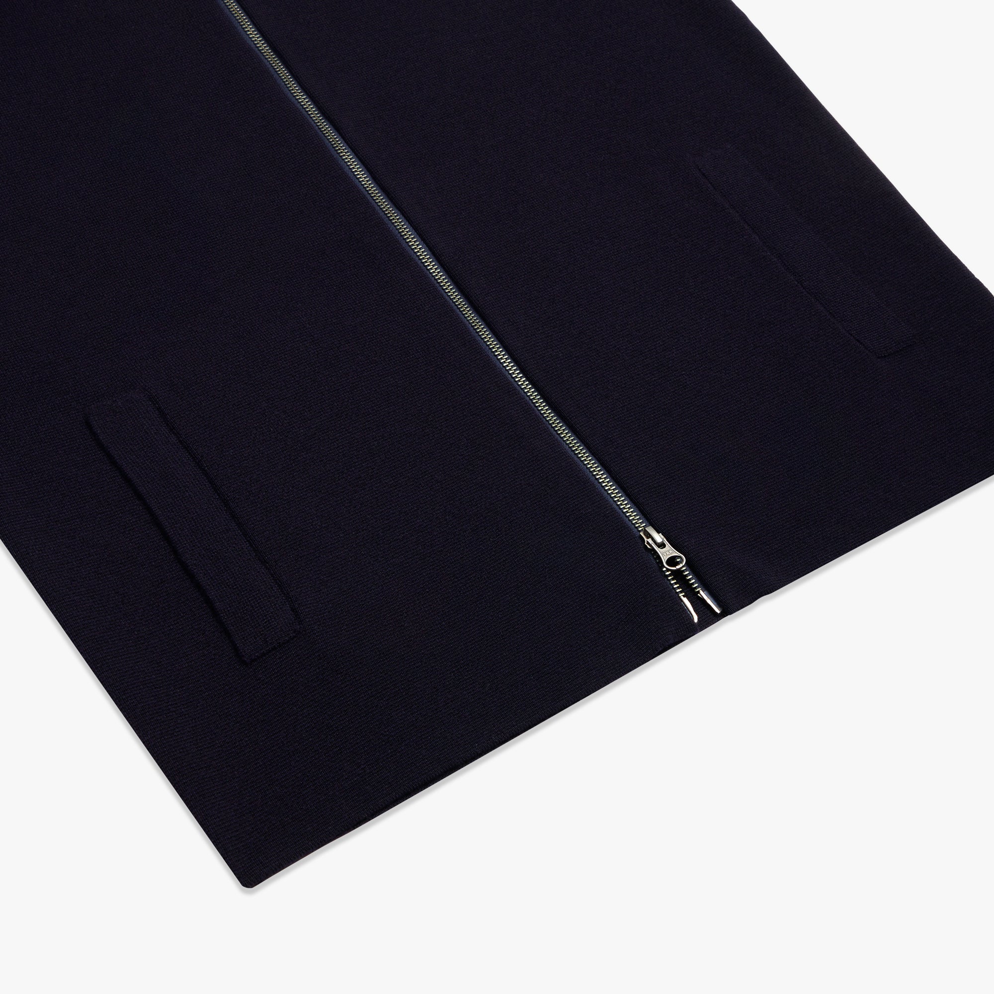 Close-up of a black jacket with a zipper on a white background