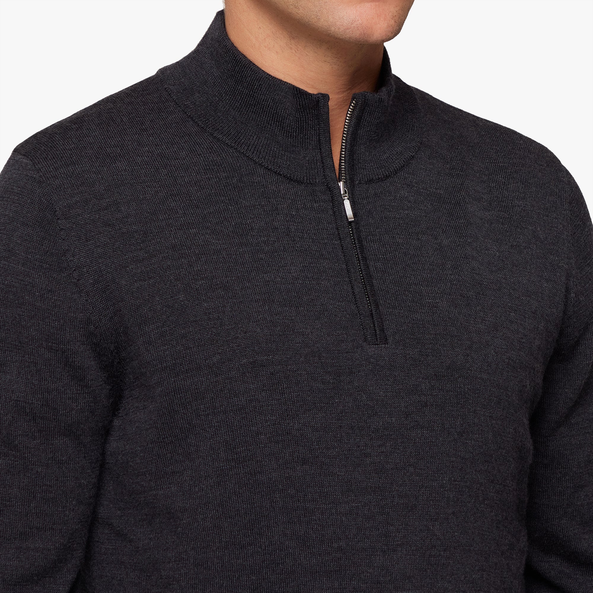 Dark gray zip-up sweater on a white background