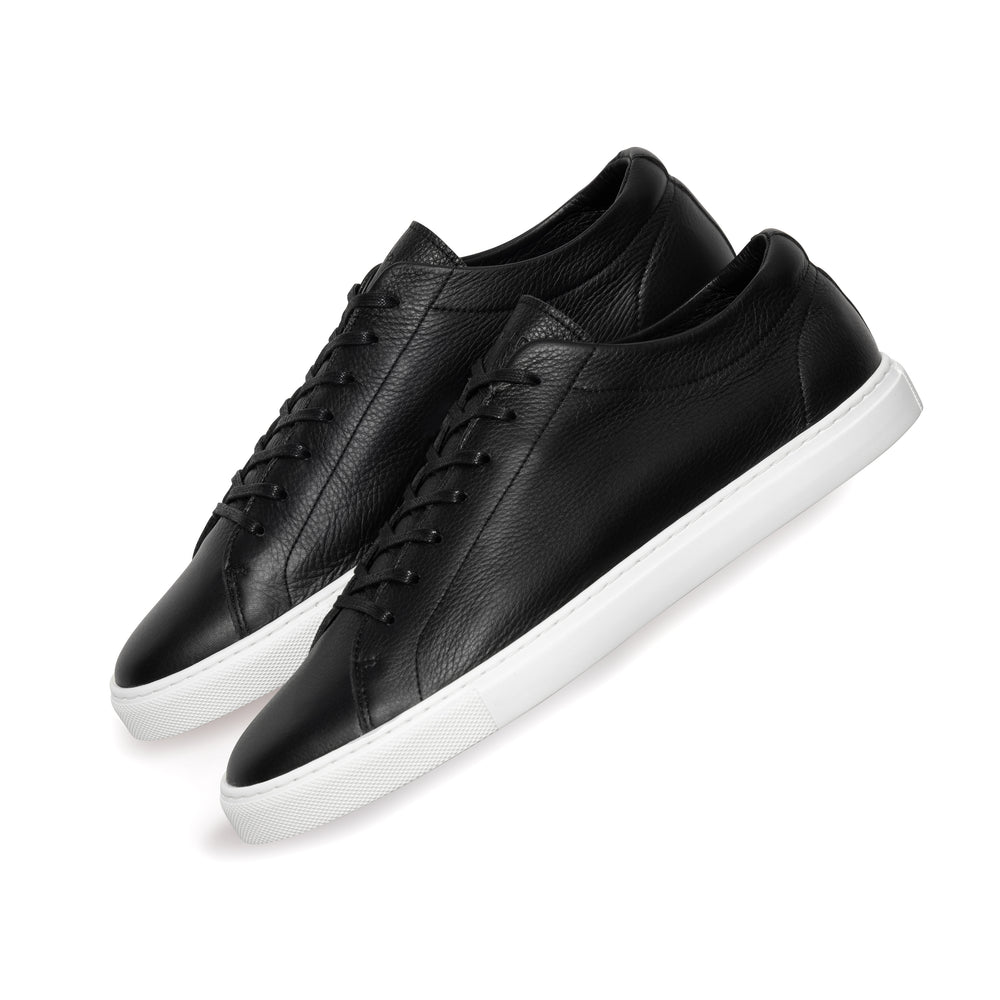 Uniform Standard Black Leather sneaker flat lay