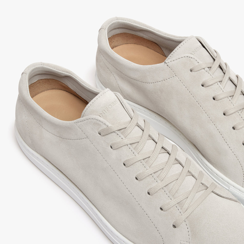 Uniform Standard Oyster Suede sneaker flat lay