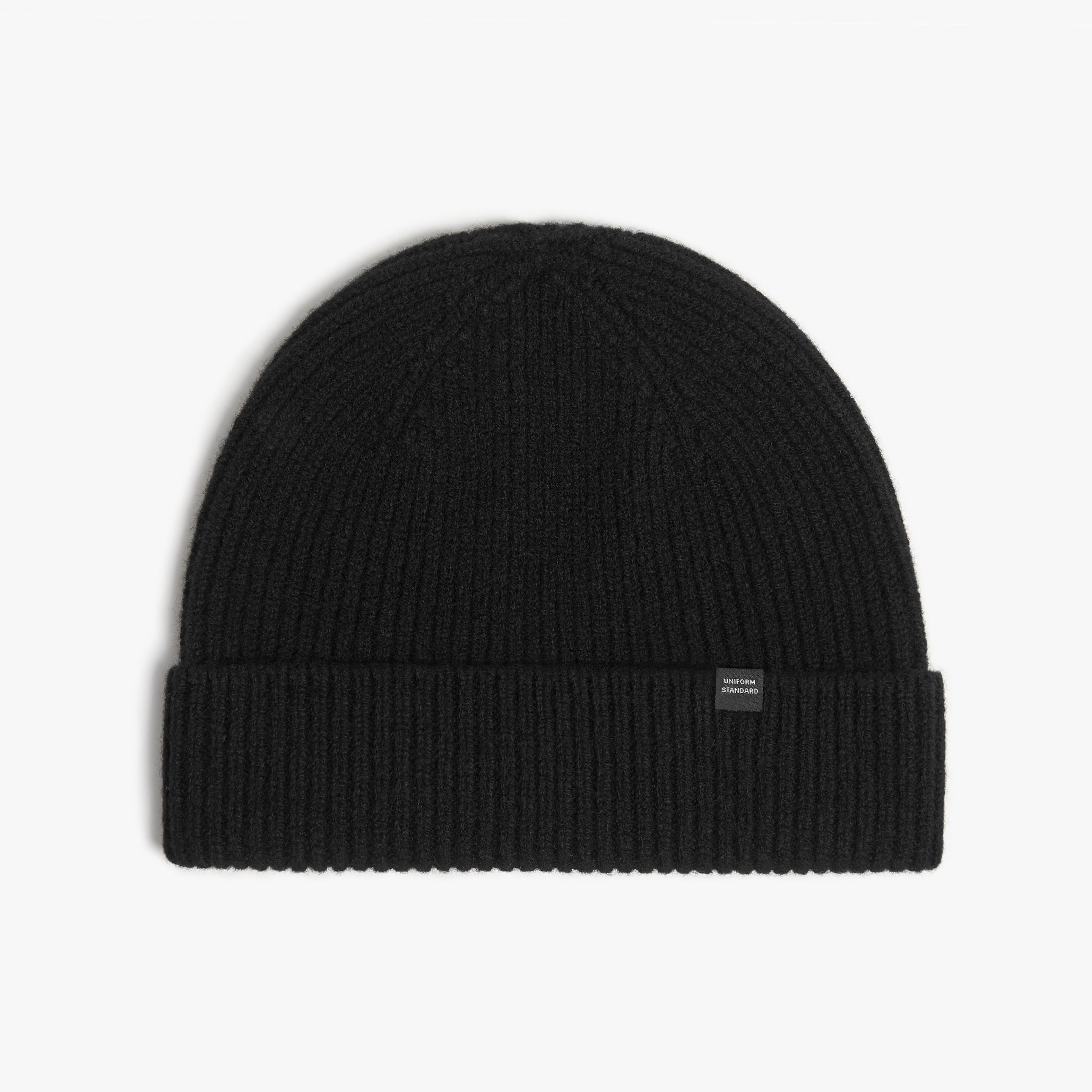 Black beanie hat on a white background