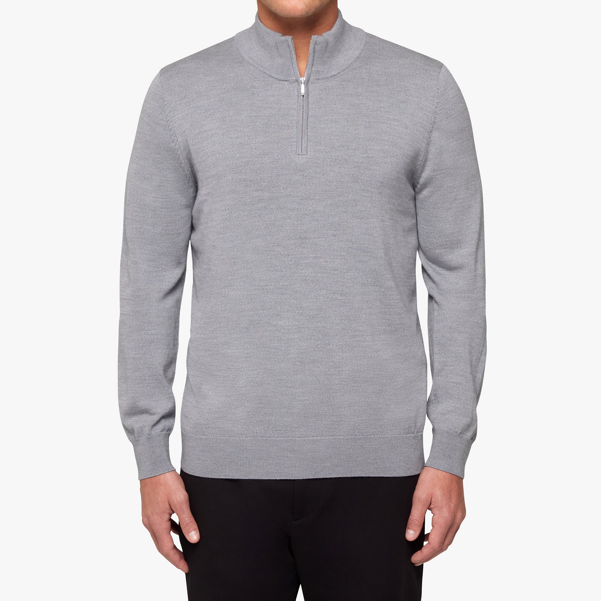 Gray half-zip sweater worn by a person on a white background
