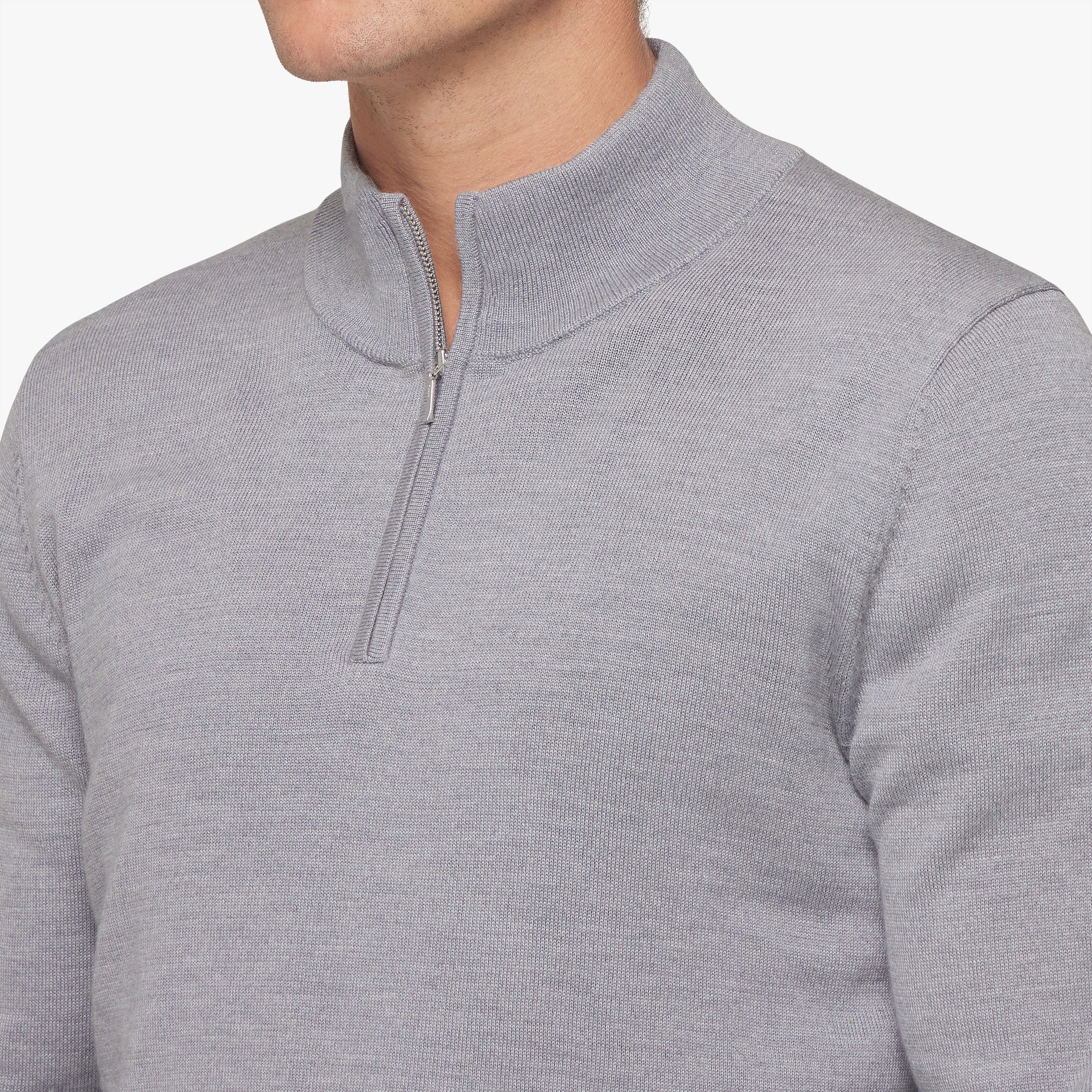 Gray zip-up sweater on a white background