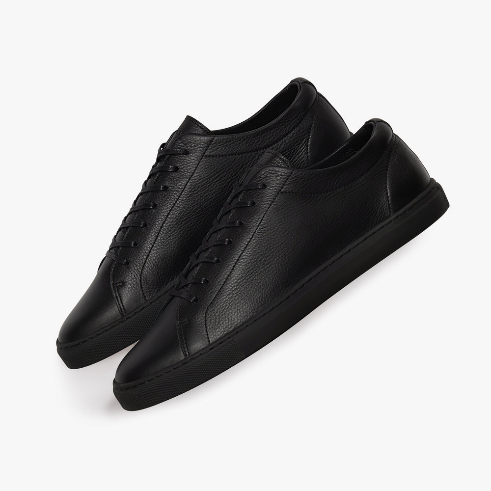 Uniform Standard Relaxed Sneaker Triple Black Leather close up